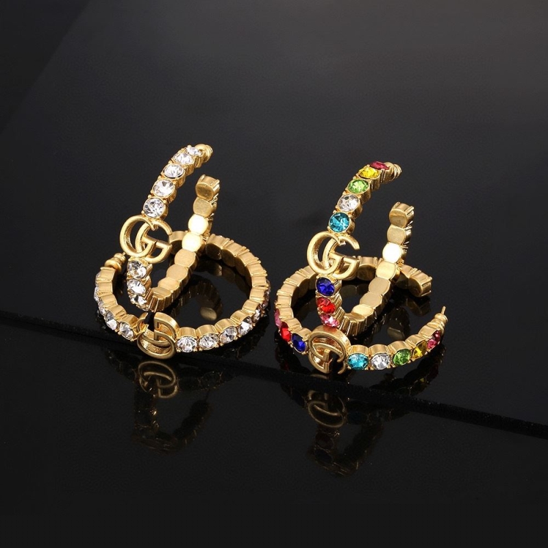 G*u*i earrings